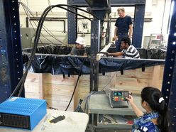 Men working on equipment in workshop