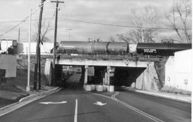 train crossing over road on a bridge